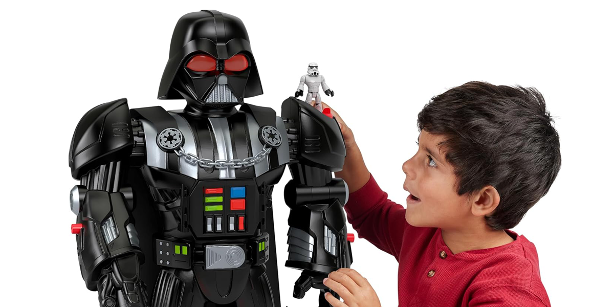 Darth vader toy and boy playing