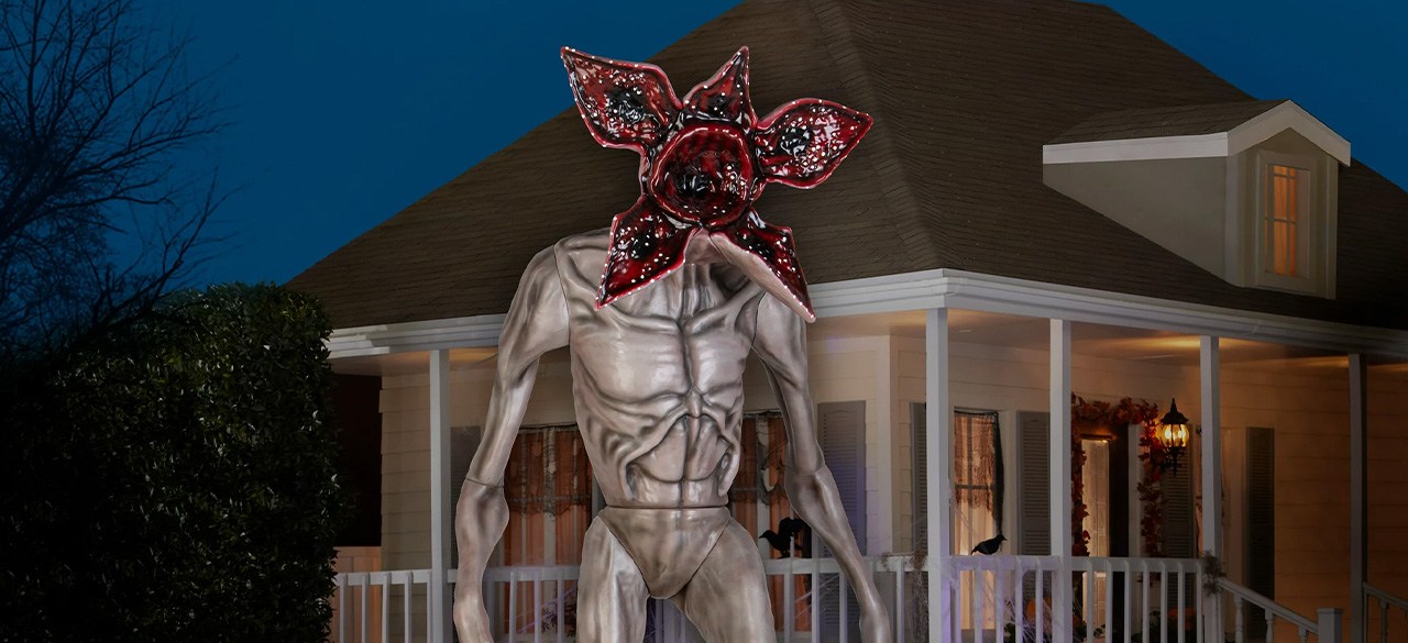 Life-sized Demogorgon inflatable in front of house at night