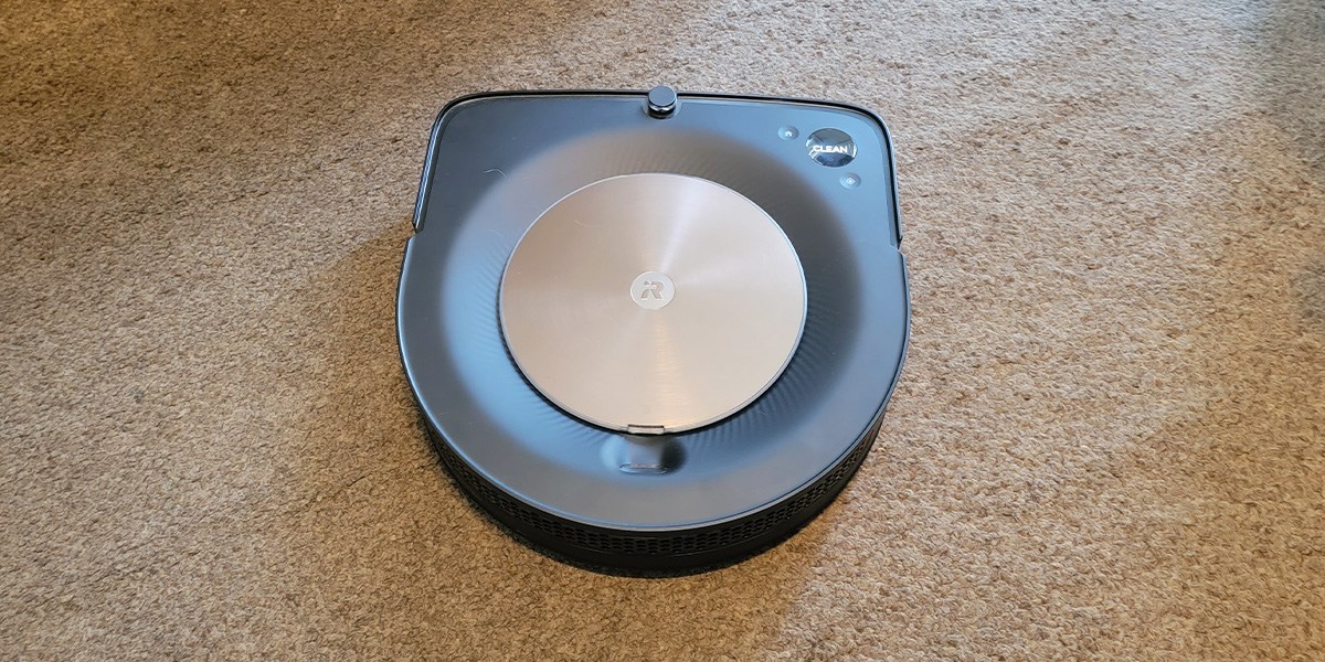 iRobot Roomba on beige carpet