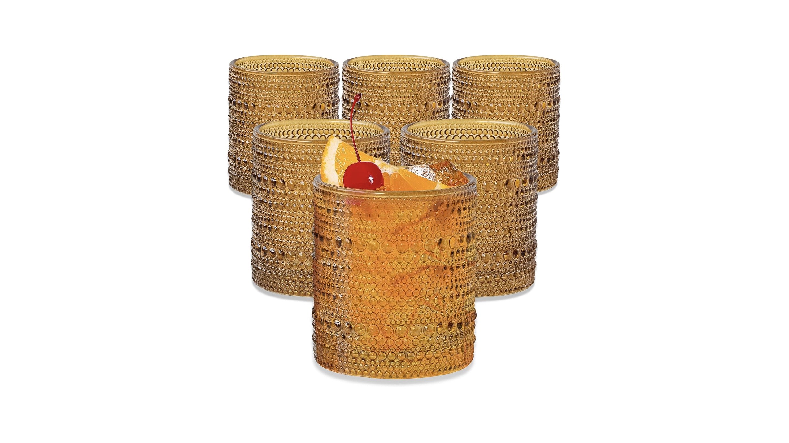 amber-colored drinking glasses with a textured outside pattern