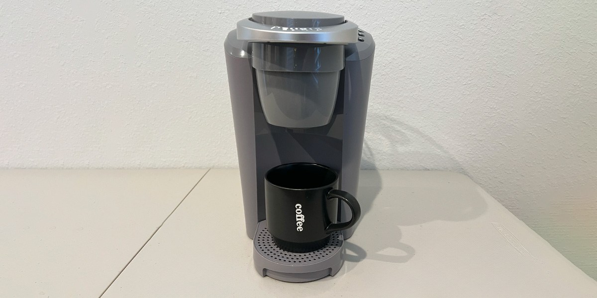 Black Keurig K-Compact with black coffee cup on counter