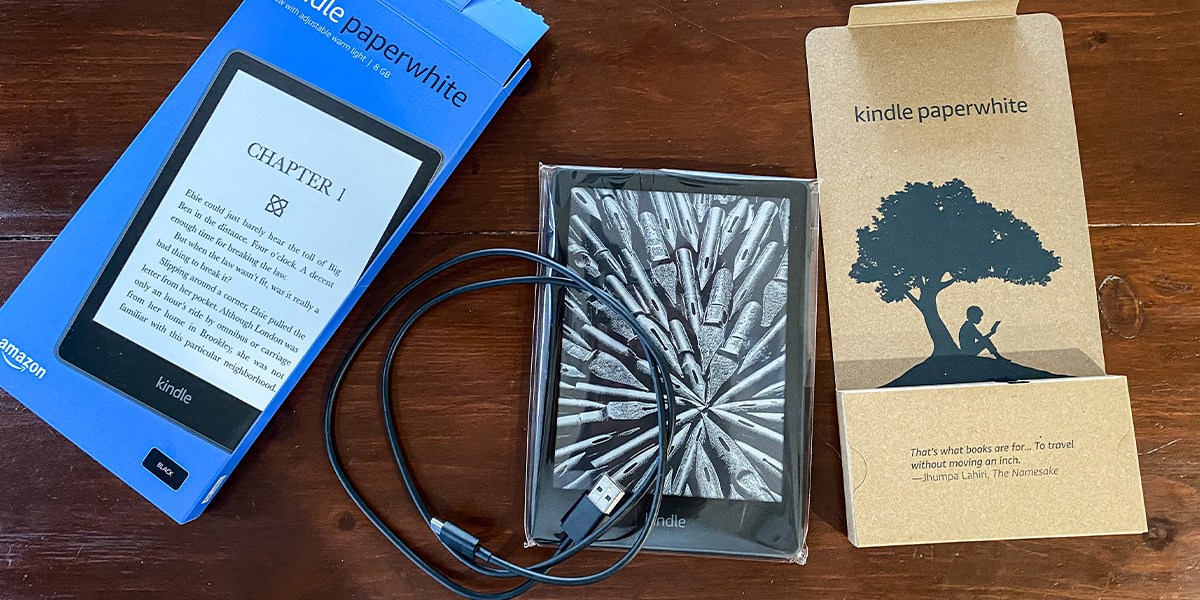 Kindle Paperwhite with product packaging on table