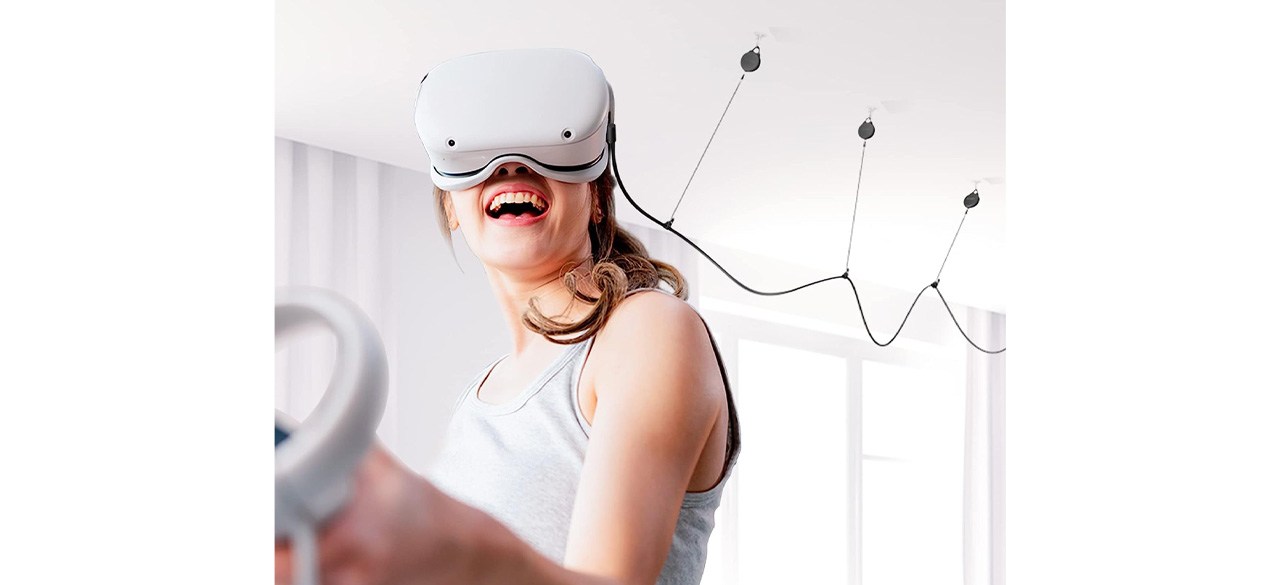 Person using Kiwi Design VR Cable Management Pulley System