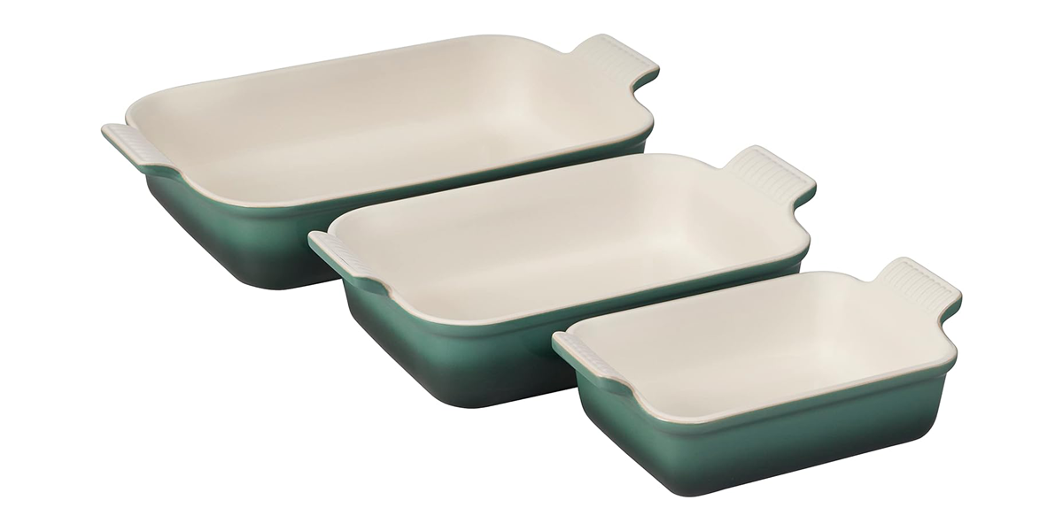 Le Creuset baking dishes in green on white background