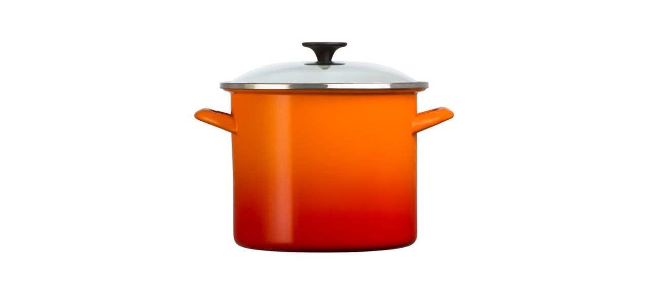 Orange Le Creuset Classic Stockpot with Glass Lid on white background