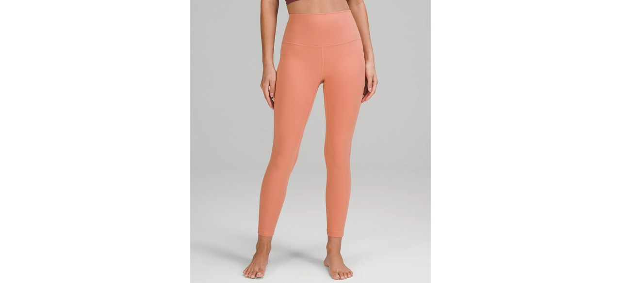 Person wearing peach-colored lululemon Align High-Rise Pant