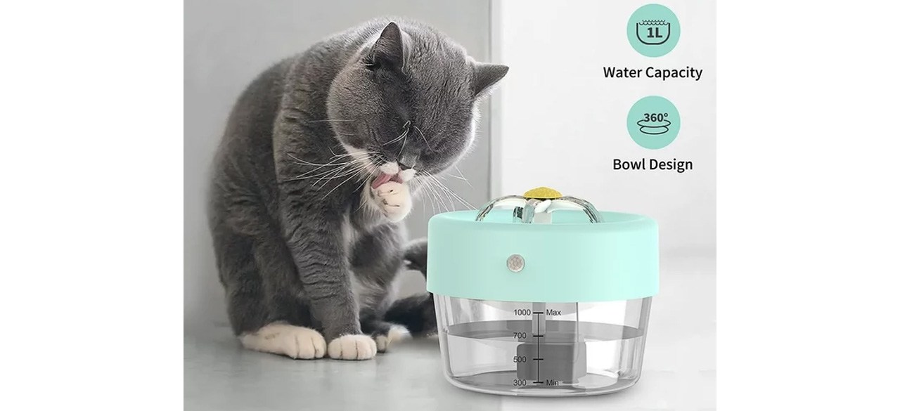 Cat licking paw next to MASBRILL Cat Water Fountain