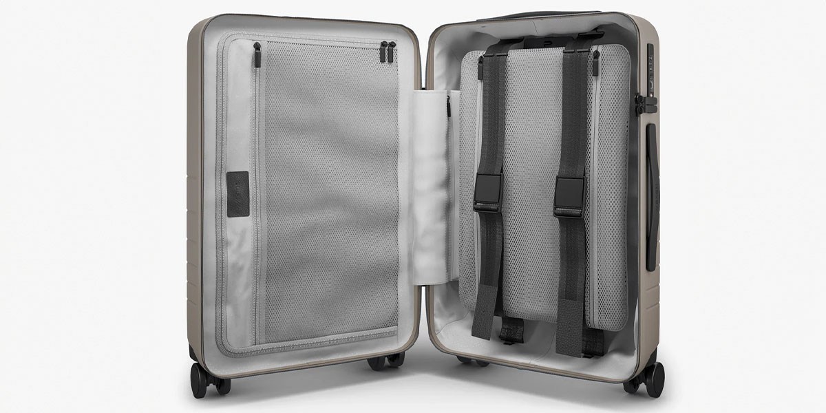 Monos Carry-On Pro Plus open, upright on wheels