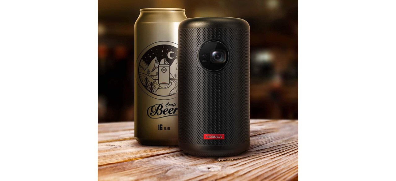 NEBULA by Anker Capsule II Smart Portable Projector next to beer can