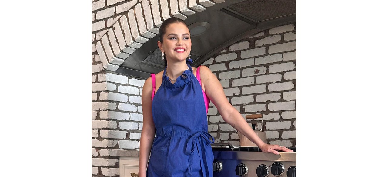 Selena Gomez wearing blue Our Place Hosting Apron