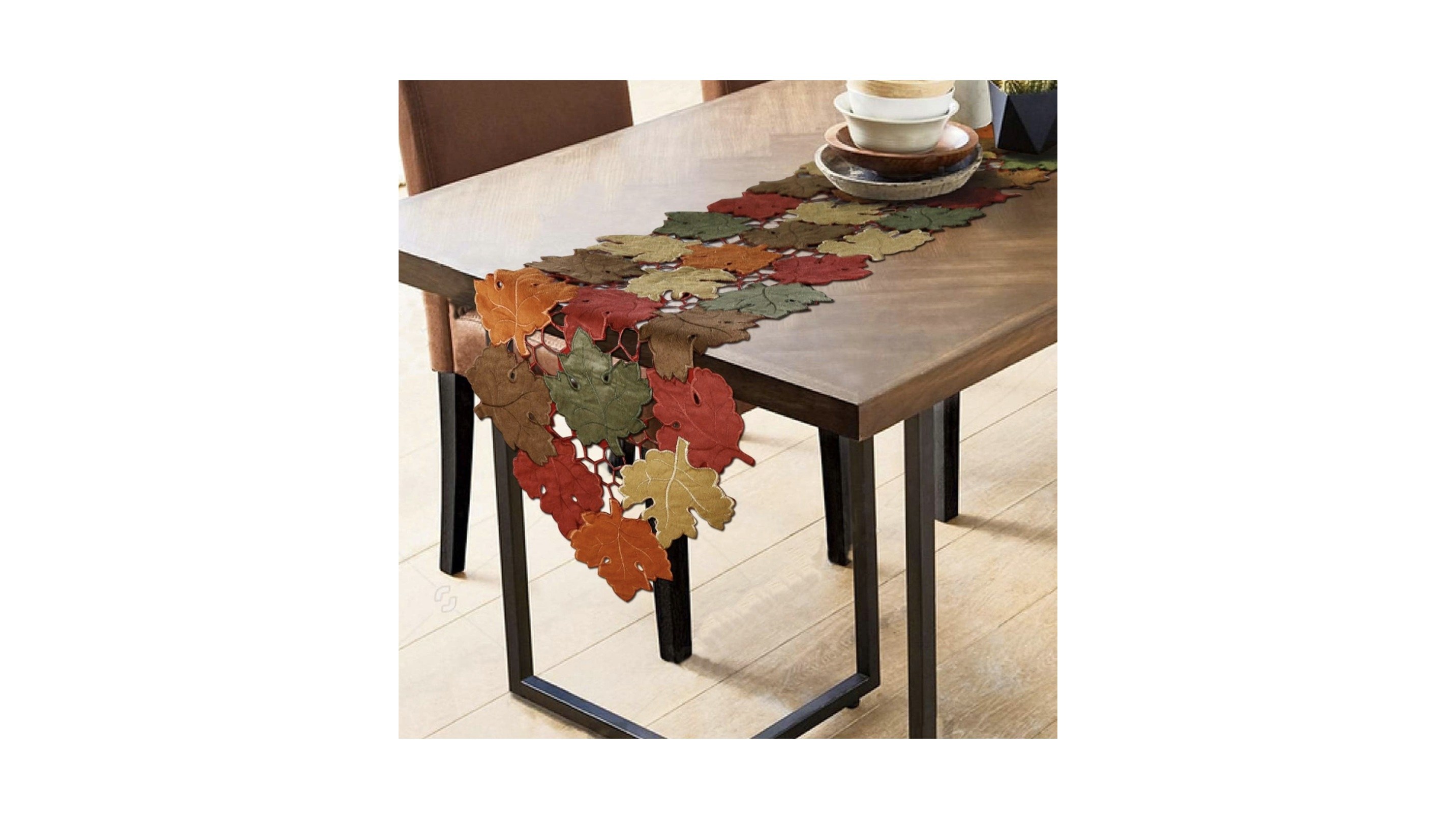 A table runner consisting of multicolored leaves sewn together