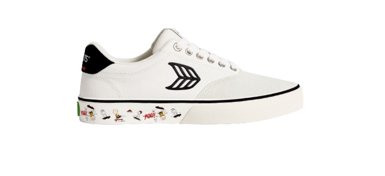 white canvas sneakers with images of Charlie Brown and Snoopy on the bottom