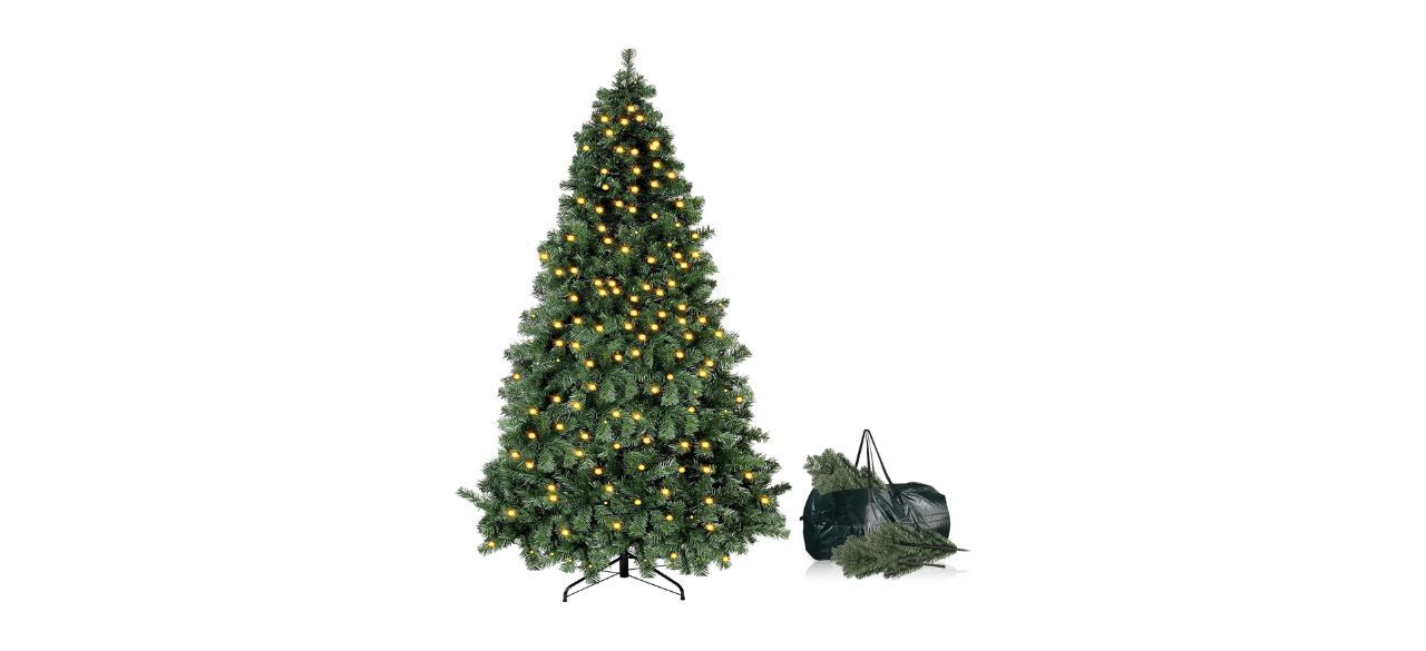 Okicoler 6.5-foot Pre-Lit Artificial Holiday Christmas Spruce Tree next to a carrying bag