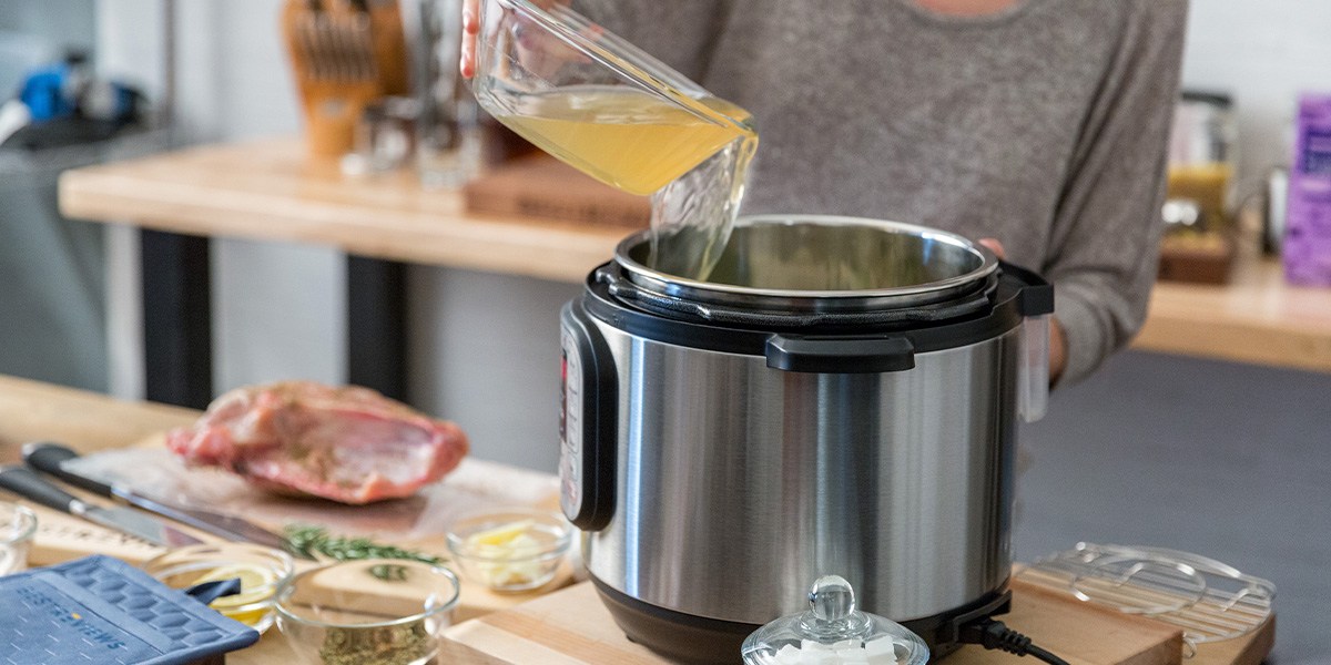 Person pouring liquid into Instant Pot