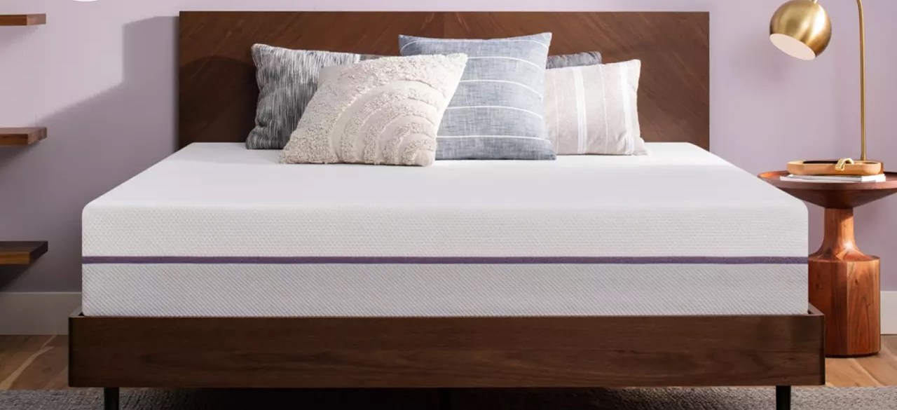 Purple Mattress in bedroom with light purple wall