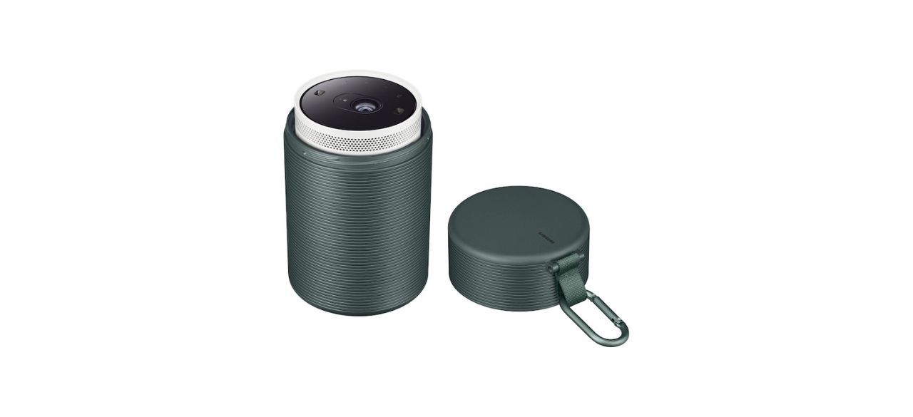 a cylindrical case to fit the Freestyle projector. It's green and has a lid with a carabiner on it.