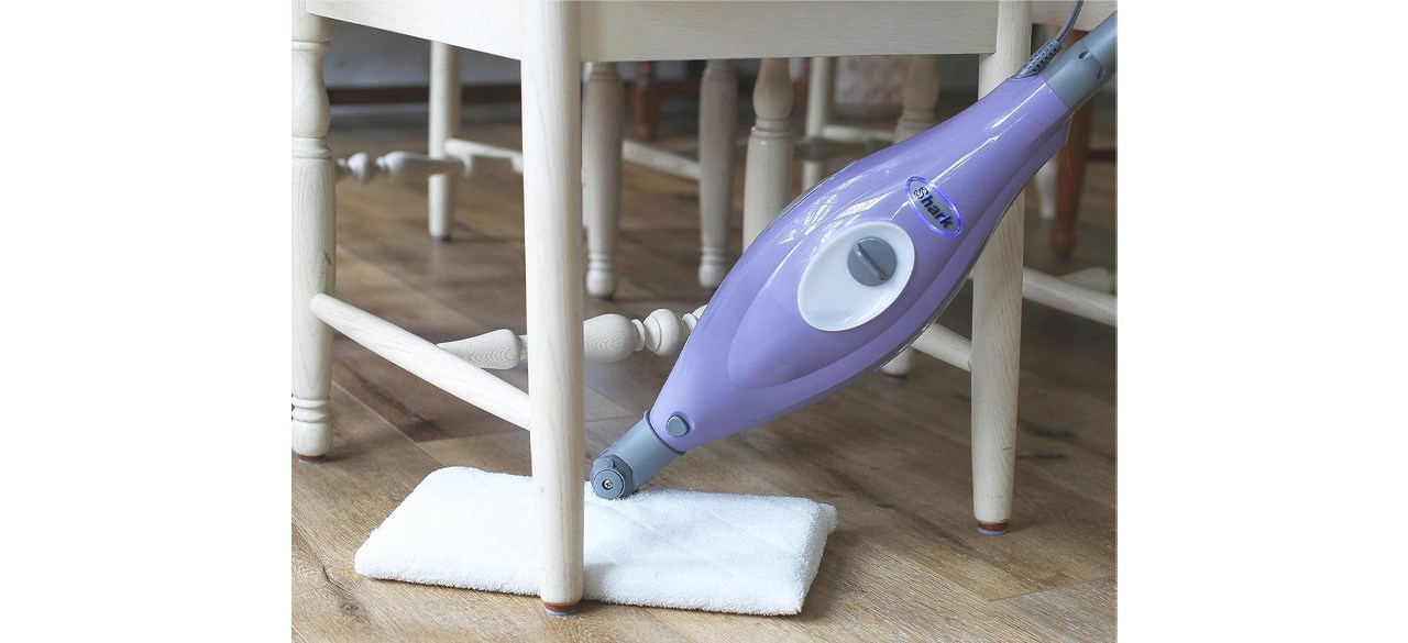 Person using Shark S3501 Steam Pocket Mop under chair