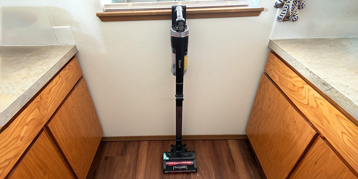 Shark Stratos Cordless leaning against wall in kitchen