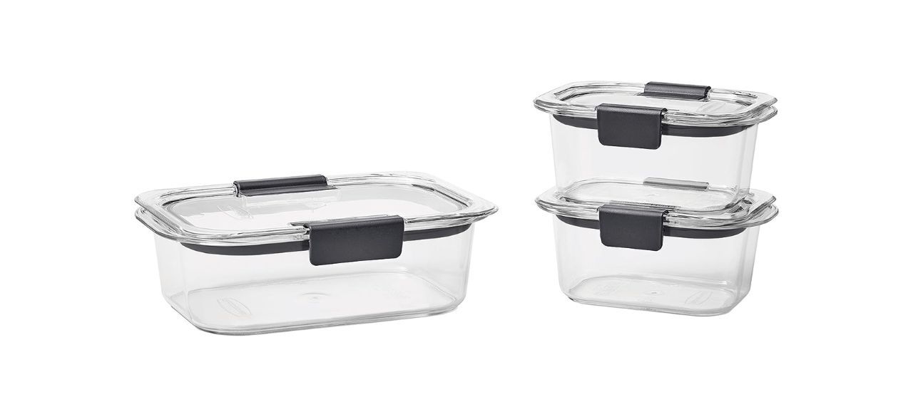 A set of 3 clear plastic storage containers with lids that have black handles. One is big and two are small.