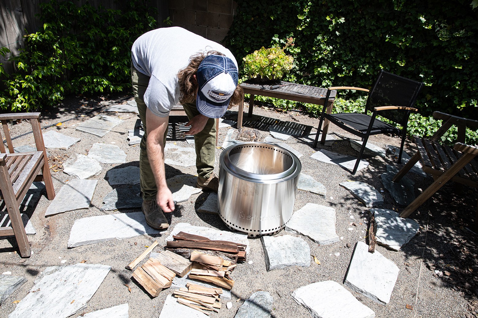 a man setting up a solo stove