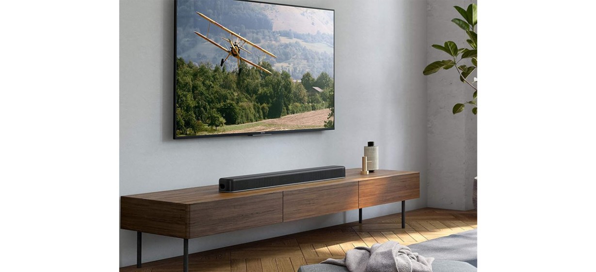 Sony HTX8500 2.1ch Dolby AtmosDTS X Soundbar on shelf below TV Sony HTX8500 2.1ch Dolby AtmosDTS X Soundbar on shelf below TV