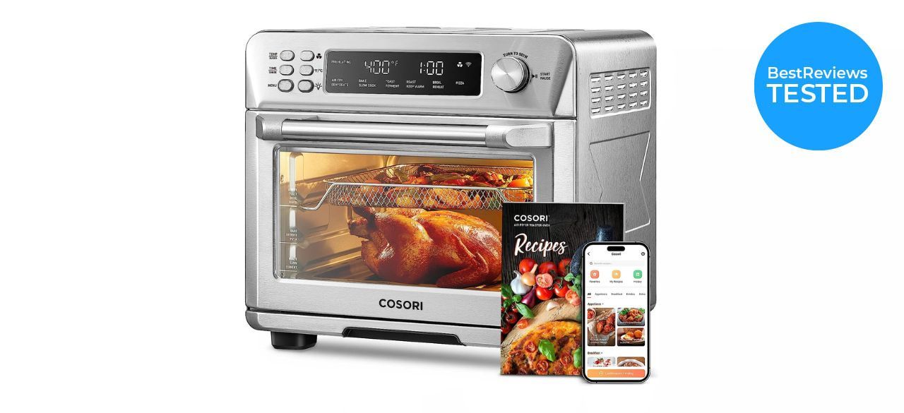 a silver Corsori Toaster Oven–Air Fryer Combo with a recipe book