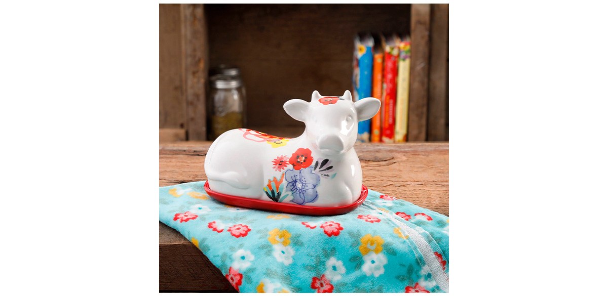 https://cdn.bestreviews.com/images/v4desktop/image-full-page-cb/the-pioneer-woman-flea-market-red-decorated-6-5-22-cow-butter-dish.jpg