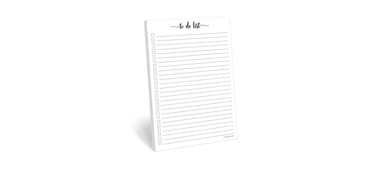 A white notepad with checkmarks next to black lines. The top reads, "to do list."