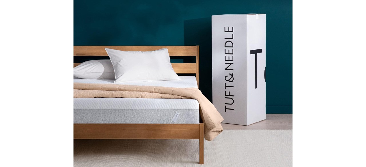 Tuft & Needle Original Queen Mattress in bedroom next to product box