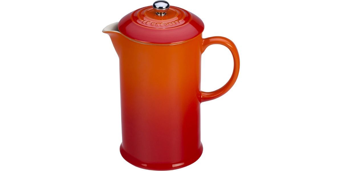 orange pitcher on white background