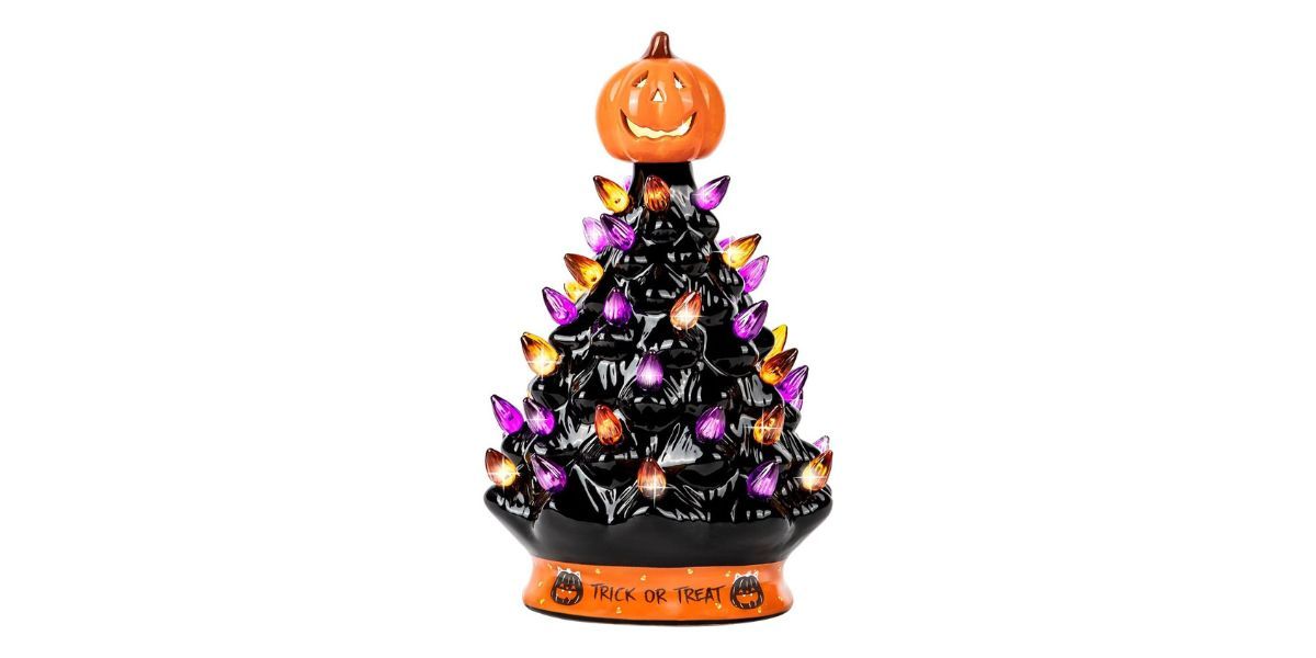 black halloween tree with colored lights and a pumpkin on top