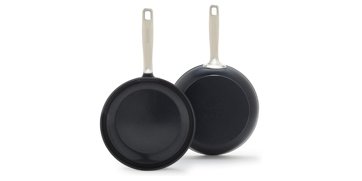 two frying pans on white background