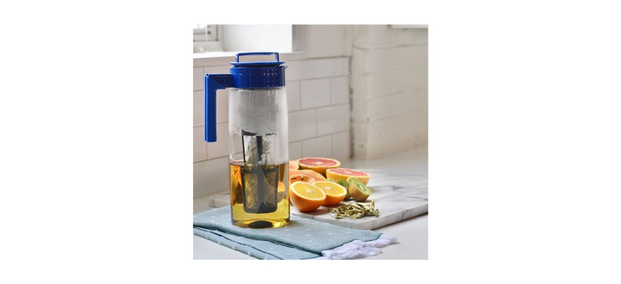 Takeya Iced Tea Maker next to some fruit in a kitchen