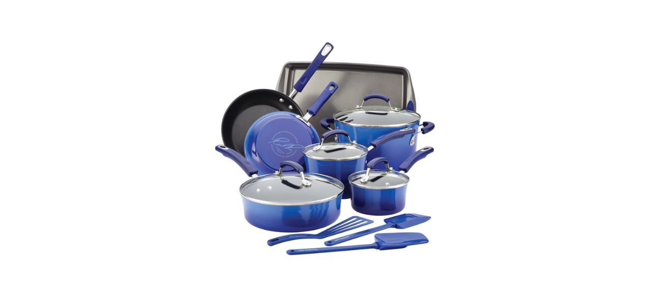 a bright blue set of pots and pans with some cooking accessories like spatulas