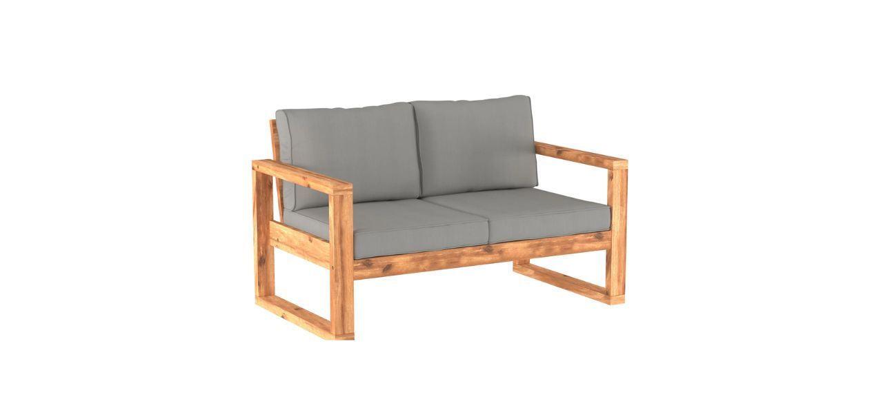 a gray outdoor loveseat with light wood accents