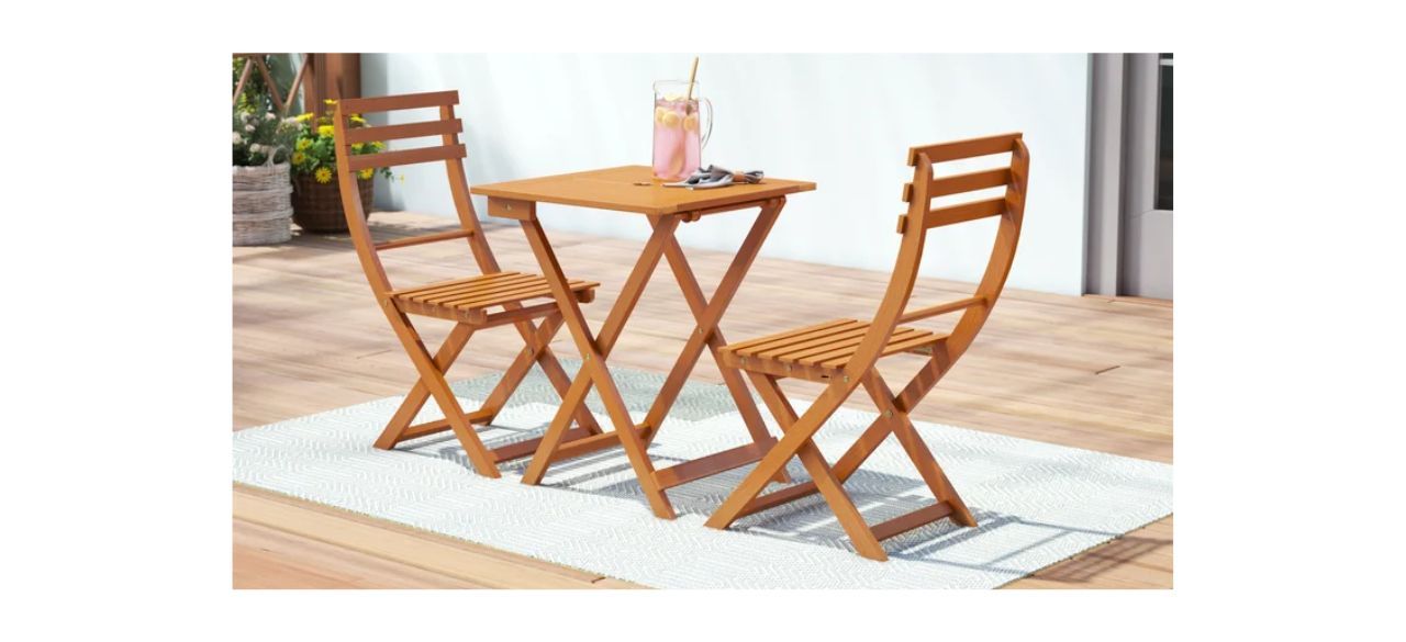 August Grove Brown Obermeyer Two-Person Square Outdoor Dining Set on a patio outside