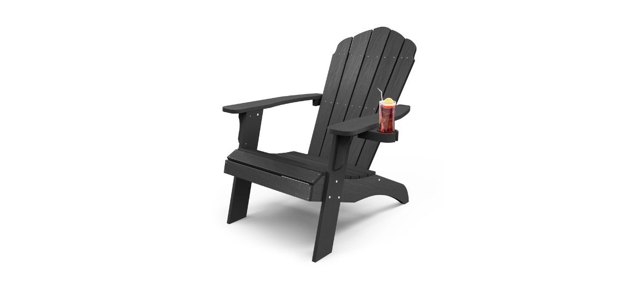 Highland Dunes Allurine HIPS Plastic Oversize Adirondack Chair with a glass of tea on it