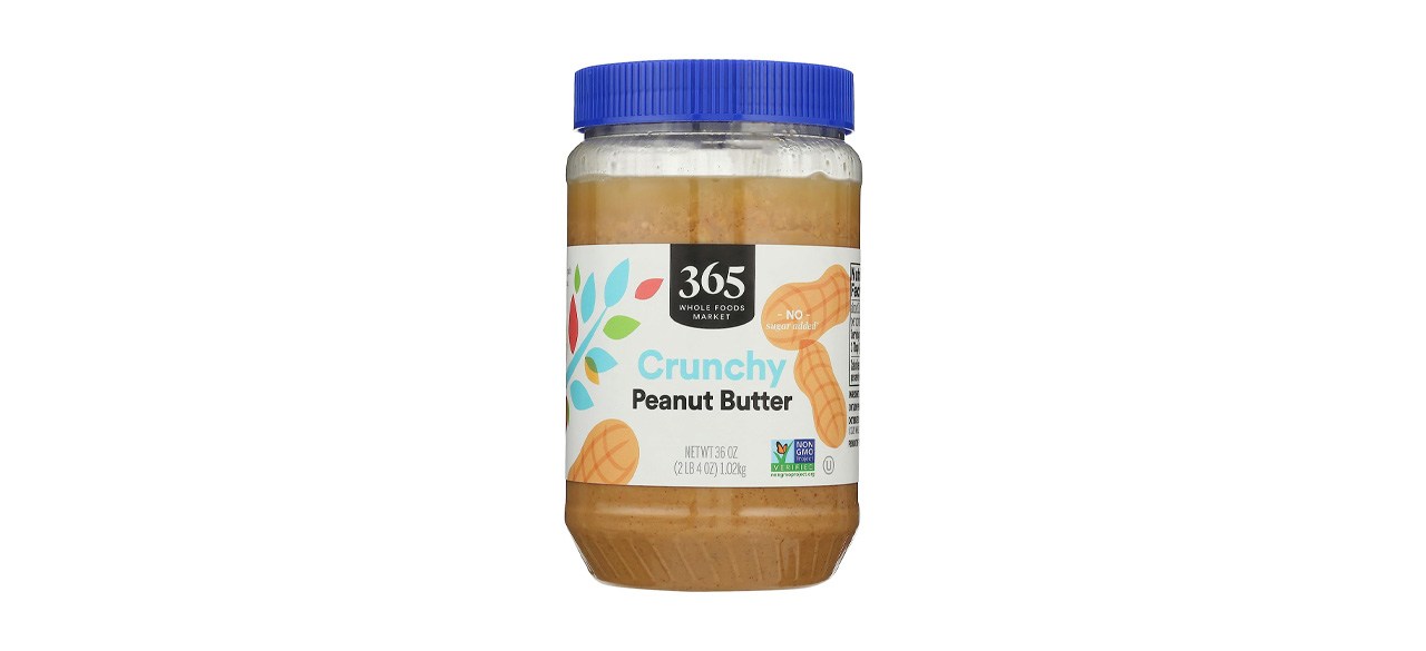 Jar of peanut butter on white background